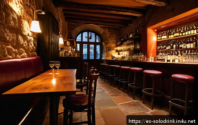 혼술과 여행   혼술하기 좋은 국내 여행지 - A cozy, intimate tapas bar in Barcelona&rsquo;s Gothic Quarter at night, featuring warm wooden furniture a...
